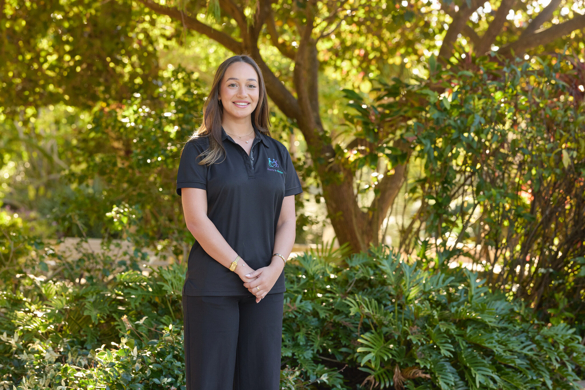 Antaylia, Hearts In Action support worker, smiling warmly - showing the real people who provide consistent NDIS support across South East Queensland